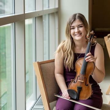 Student holding a violin