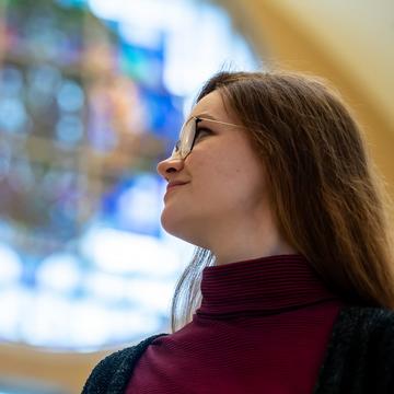 Student standing in chapel