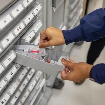 Student putting a medical cartridge away