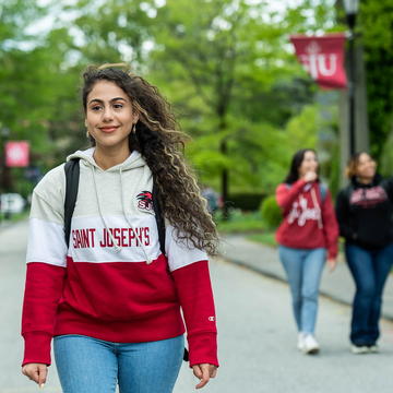 Saint Joseph's University students walking on campus.