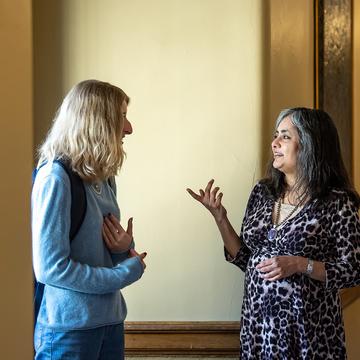 Professor speaks with student in Barbelin Hall on Saint Joseph's University's campus