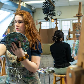 Saint Joseph's University Students working on a art project painting