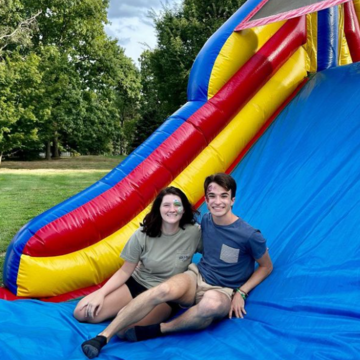 Two students on a moon bounce