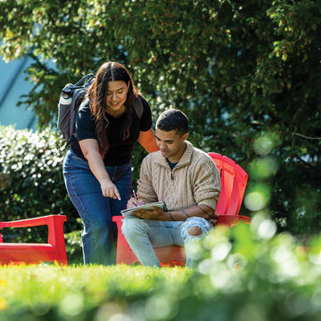 Saint Joseph's University students working together on a project outside.