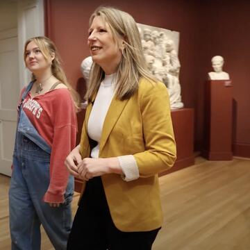 Dr. McConnell walking through museum with Kelly Slater