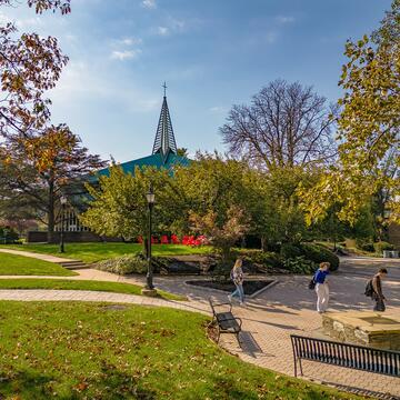 students walking outside near Foley Center