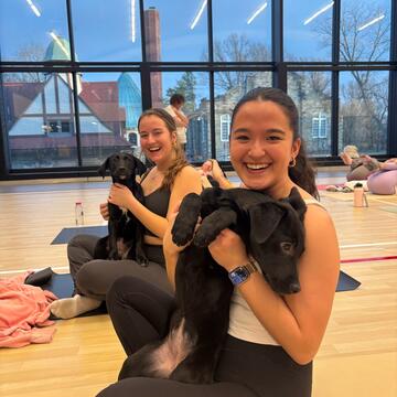 Students Holding Puppies