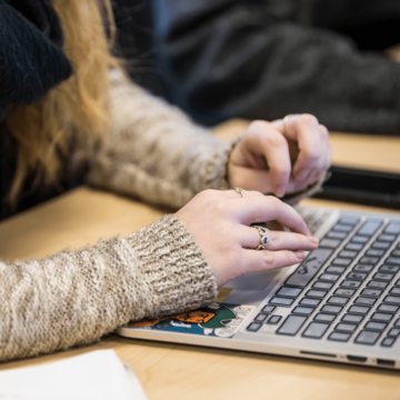 hands at laptop