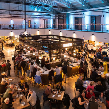 An indoor market bustling with people