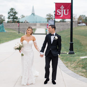 bride and groom walking hand-in-hand