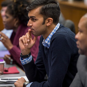 eMBA student sitting in classroom and interested in lecture