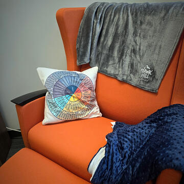 comfortable recliner with an orange colored surface