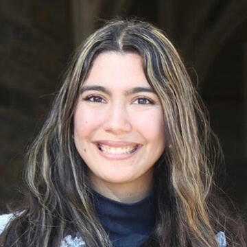 A woman with long hair smiling