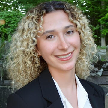 A woman smiling at the camera