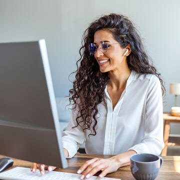 adult learner looking at computer