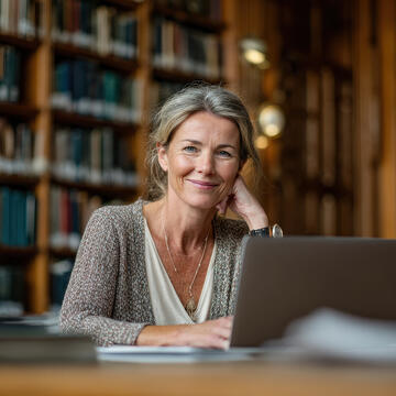 continuing education student at laptop