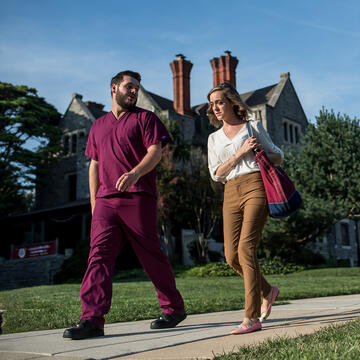 two students walking on campus