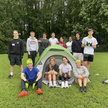 Students smiling after blind tent