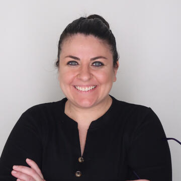 A woman smiling