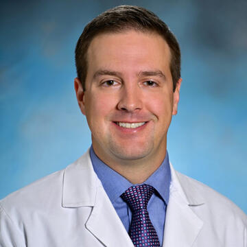 A man in a doctor's coat