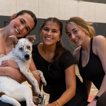 Students Holding Puppies