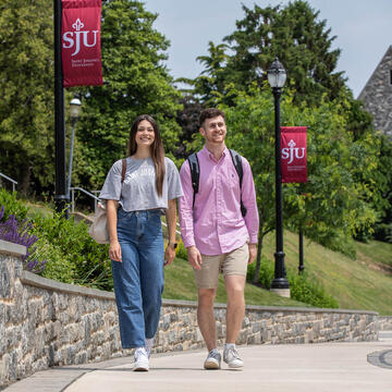 male and female students walking on campus