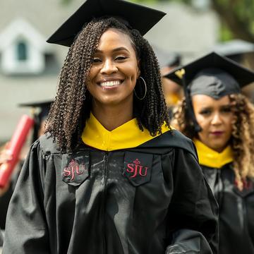 two saint joseph's university students at their commencement