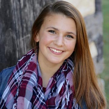 female saint joseph's student wearing a purple scarf