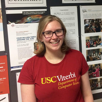 Sarah Cooney wearing glasses and a red shirt