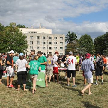 Activities Fair 2016 with students surrounding tables on Curran Field
