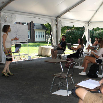 students and teacher in an outside classroom at Saint Joseph's University