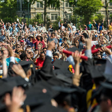 Members of the Saint Joseph's University community cheer on the graduates.