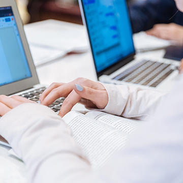 Saint Joseph's University student studying with a laptop