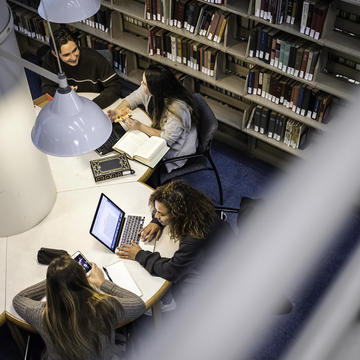 Students sitting inside Drexel Library at Saint Joseph's University
