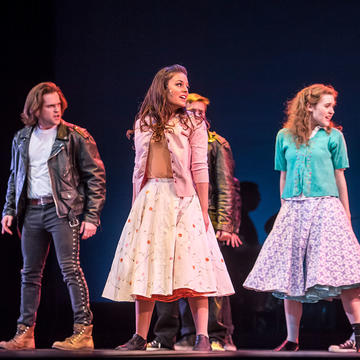 saint joseph's university students performing "The Who's Tommy" on stage
