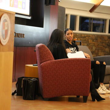 Natasha Cloud, facing camera, is interviewed by Stephanie Tryce