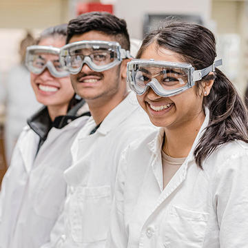 Saint Joseph's Biochemistry students in lab coats.