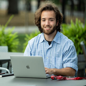 male student using a laptop
