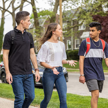 three saint joseph's university students walking outside
