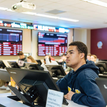 a college student inside a data analytics lab