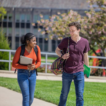 two students walking outside on saint joseph's campus