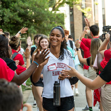 saint joseph's university first-year student giving high fives during orientation