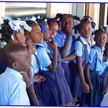 Young schoolchildren dressed in blue uniforms