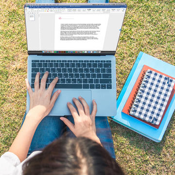 Student Studying on the grass