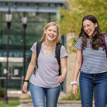 Two undergraduate students by Saint Joseph's Student Center.