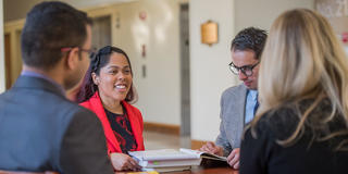four business students talking at saint joseph's university