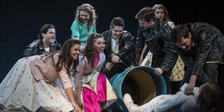 Students performing The Who's Tommy in Bluett Theatre