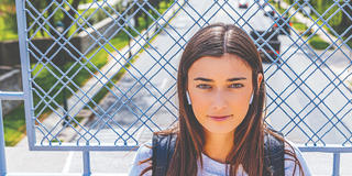 Female student looking directly at the camera on McShain Bridge