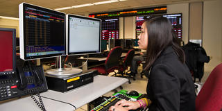 female finance student in the wall street trading room at saint joseph's university
