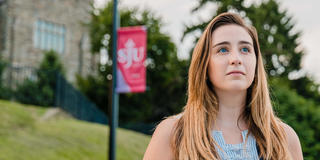 Graduate Haub School of Business student outside Mandeville Hall at Saint Joseph's University